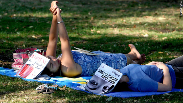 Harvard grads Jin-ah Kim, left, and Lia Tjahjana take a reading break in Cambridge, Mass. -- Amazon's "most well-read" city.