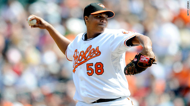 Orioles pitcher surrenders to police on murder charge