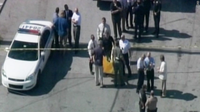Officer Roger Castillo died at the scene in the city's Liberty City Officer Roger Castillo died at the scene in the city's Liberty City