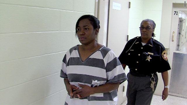 Kelley Williams-Bolar is escorted through the Summit County, Ohio, jail last week.