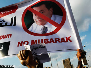 Protestors hold an anti Hosni Mubarek sign in Tahrir Square during afternoon anti-government protests today in Cairo.