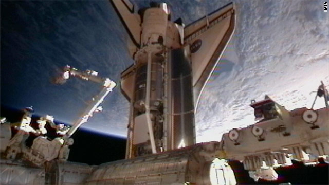 Shuttle Discovery docks with space station for 13th and final time