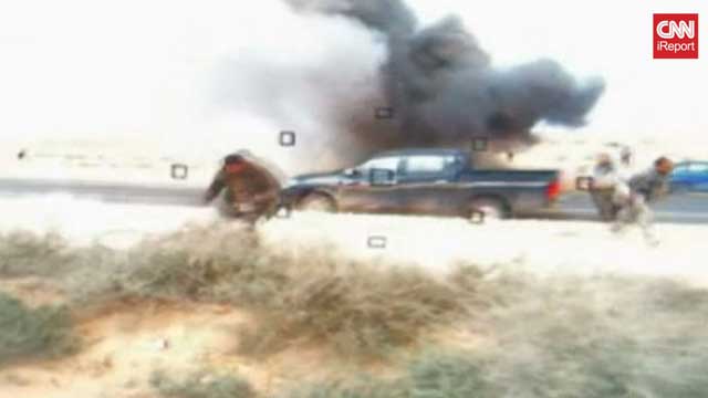 Gotta Watch: Libya under fire; John Oliver gets serious; police car smashed