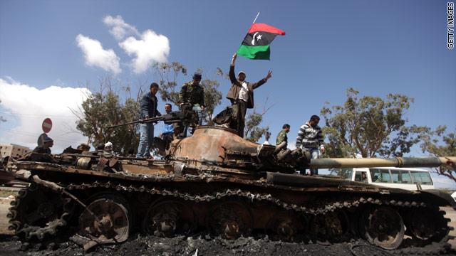 Obama playing defense over Libya