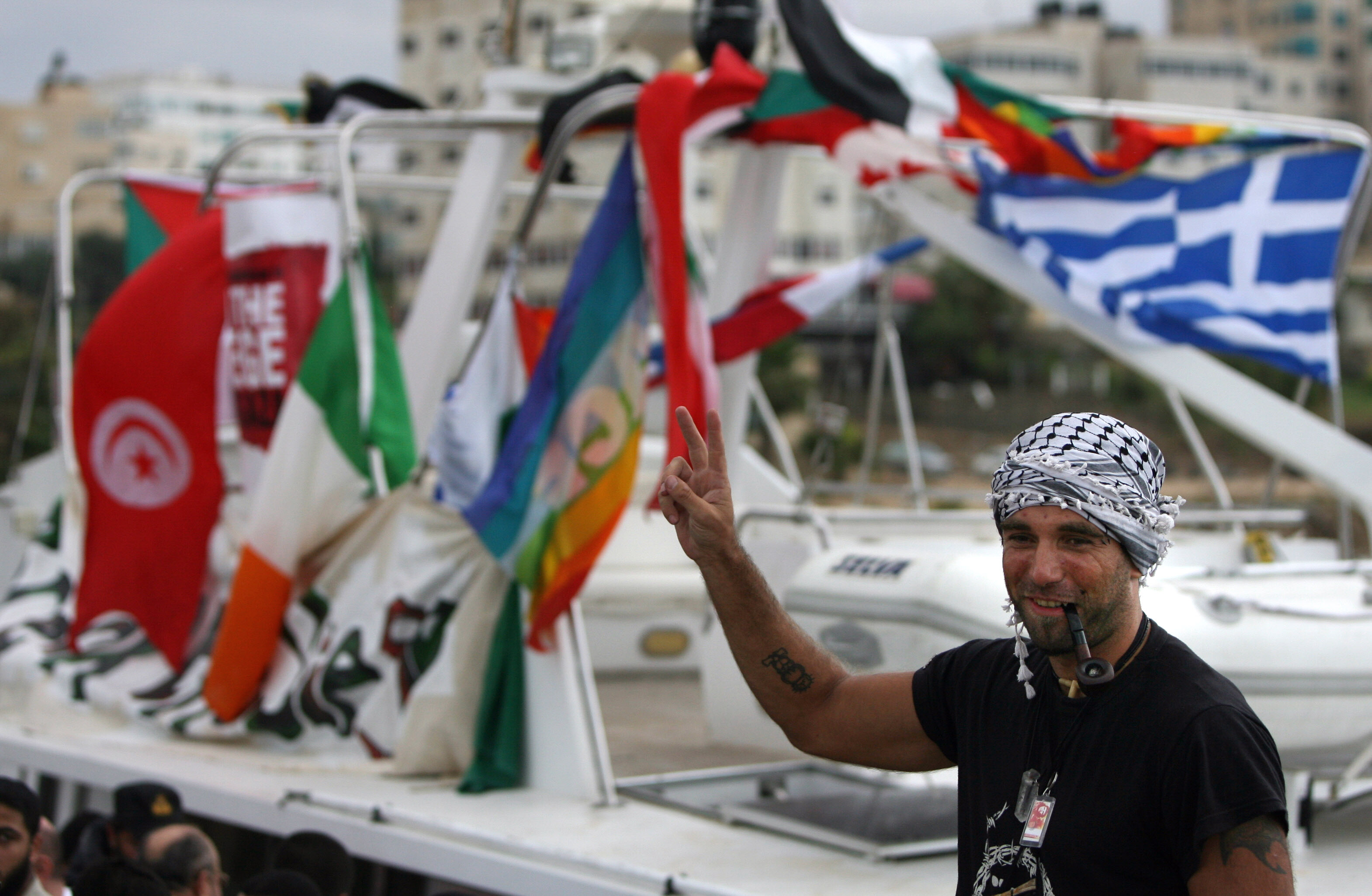 Vittorio Arrigoni at the port in Gaza City celebrating the arrival of the ship Dignity that departed from Cyprus to protest against the Israeli sanctions. A Salafist group of radical Islamists killed the Italian activist after kidnapping him in Gaza Getty Images AFP.