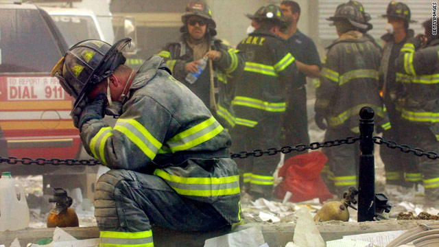 A firefighter breaks down after the World Trade Center buildings collapsed 