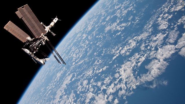 NASA shows first pics of shuttle docked to space station