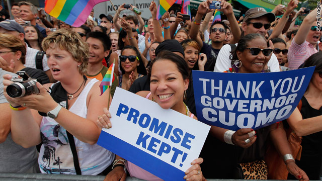 marchers hold signs thanking governor andrew cuomo for keeping his ...