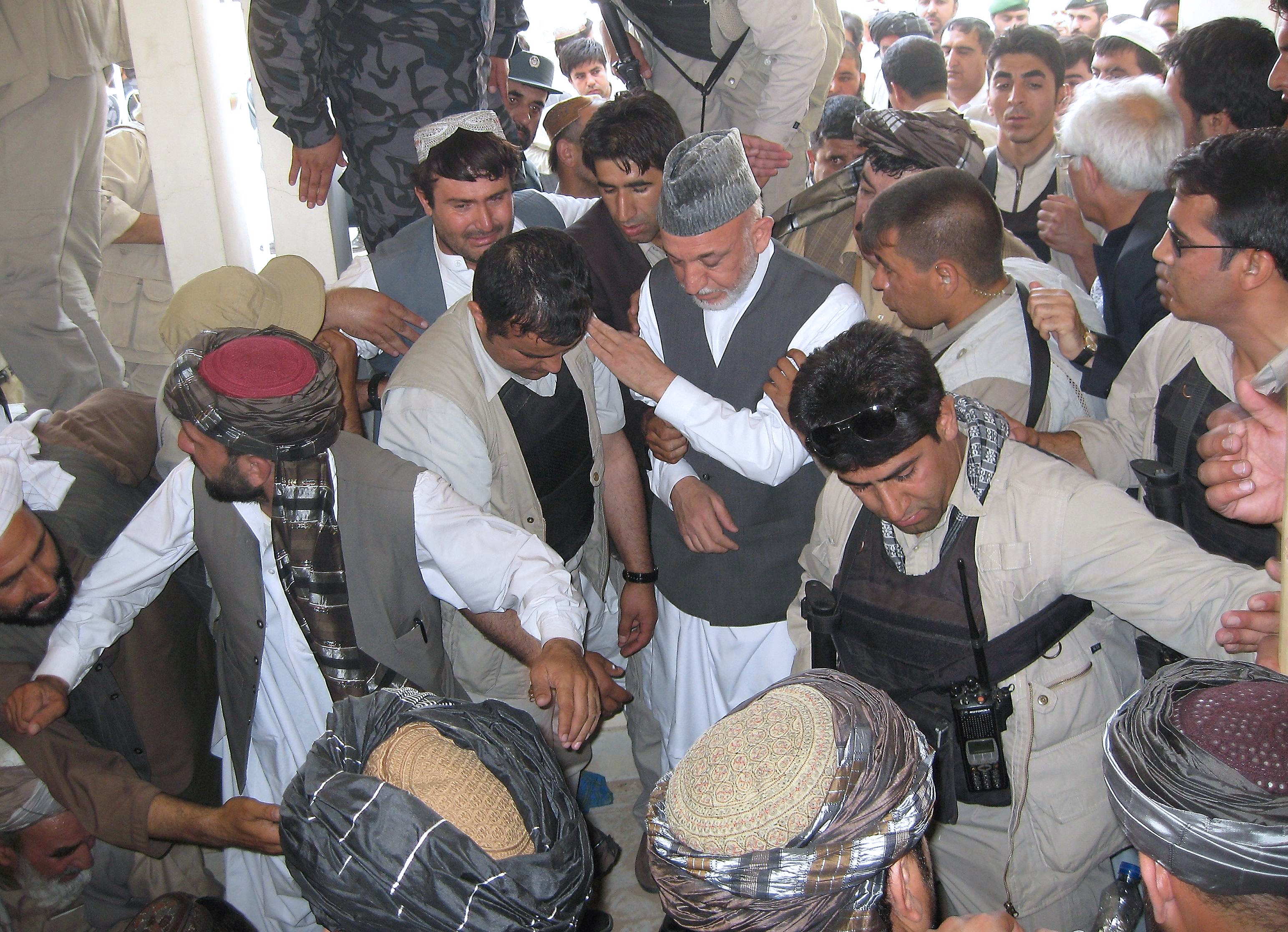 Killer of Karzai's half-brother worked against Taliban, officials say