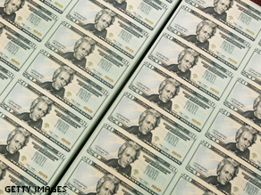 Sheets of freshly made $20 bills lay in stacks at the Bureau of Engraving and Printing.