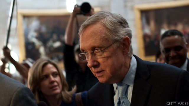 Reid backs debt agreement, pending caucus agreement