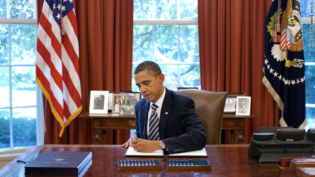 Obama signs debt ceiling bill, ends crisis