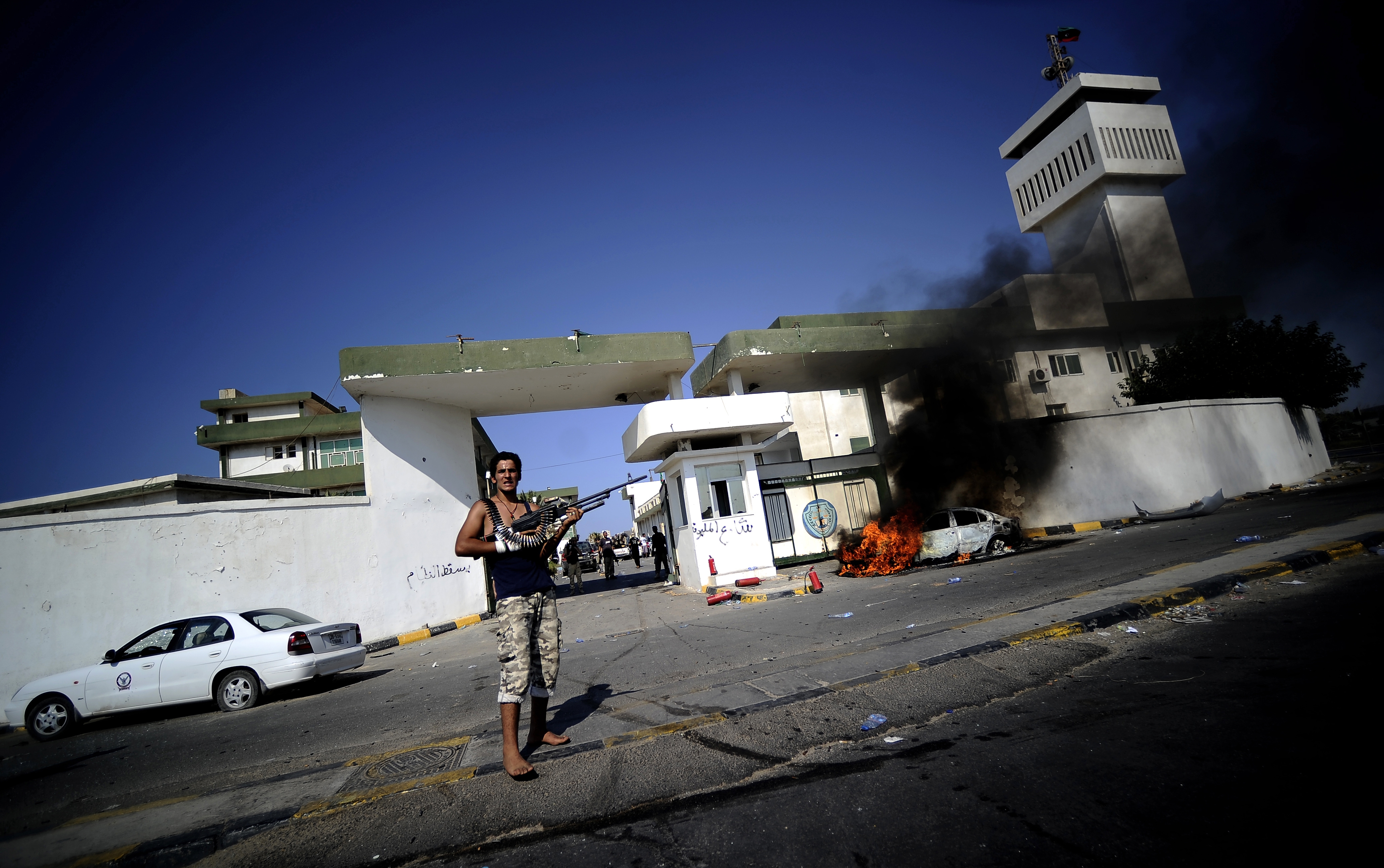 Need to Know News: Rebels launch siege on Gadhafi compound as residents flee Tripoli