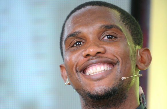 Samuel Eto'o smiles during the press conference to confirm his big-money move to Anzhi Makhachkala.