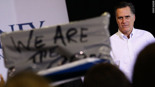 Romney pushes back after protesters interrupt rally
