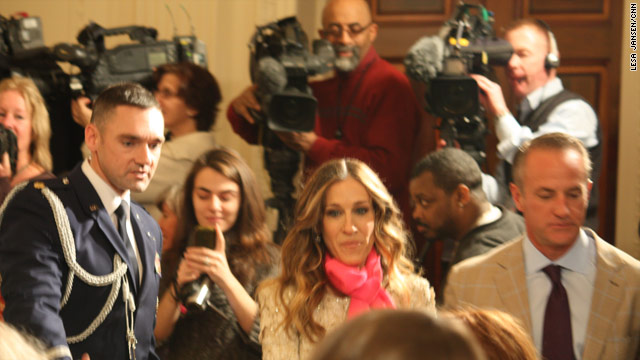 The movie star switches roles with paparazzi at White House