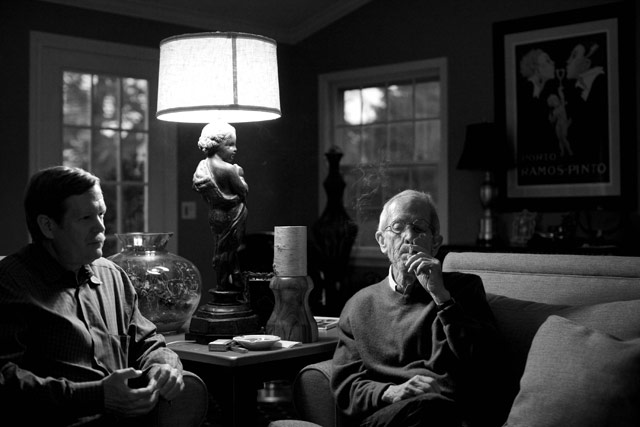 Peter Leonard listens in his family room while his father, Elmore, smokes and talks about writing.
