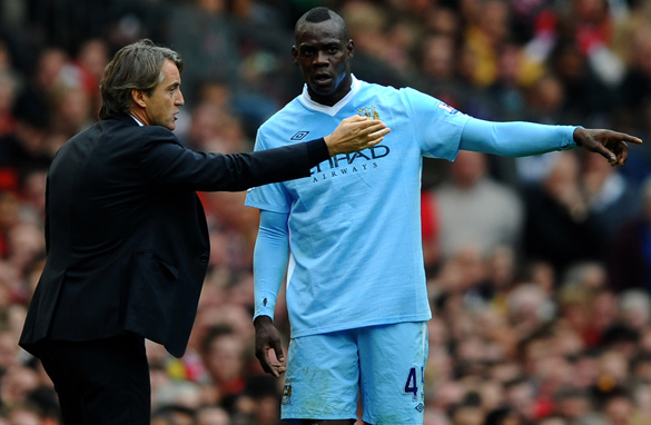 Manchester City boss Roberto Mancini, left, has finally lost patience with Mario Balotelli. (Getty Images)