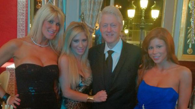 Clinton poses with porn stars