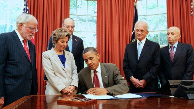 Obama signs U.S.-Israel security act on eve of Romney trip