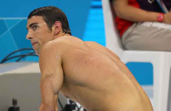 A despondent Michael Phelps ponders what could have been after he came fourth in the 400m individual medley. (Getty)