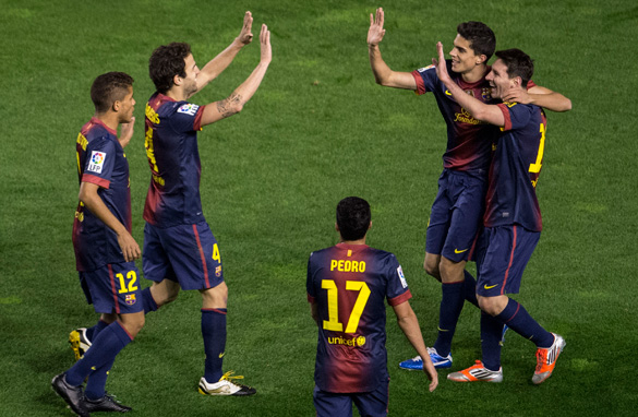 Lionel Messi celebrates with his Barcelona teammates after scoring his 300th career goal on Saturday. (Getty Images)