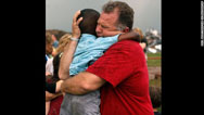 Neighbor comforts 3-year-old tornado survivor
