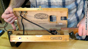 The inside of the cigar box guitar reveals its craftsmanship.