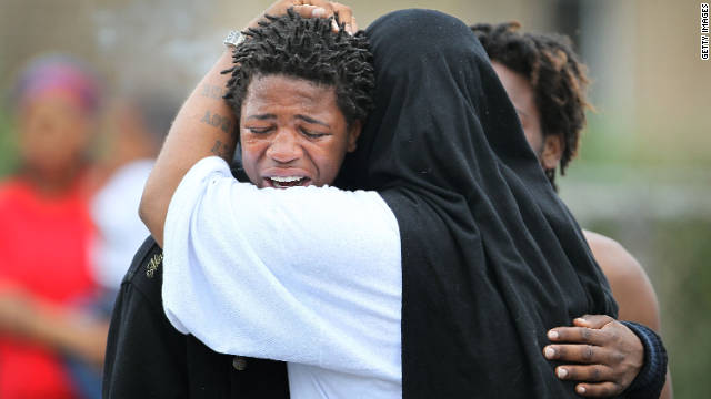 A young man grieves last year near a spot in Chicago's South Side where the bodies of two teenage boys were found.