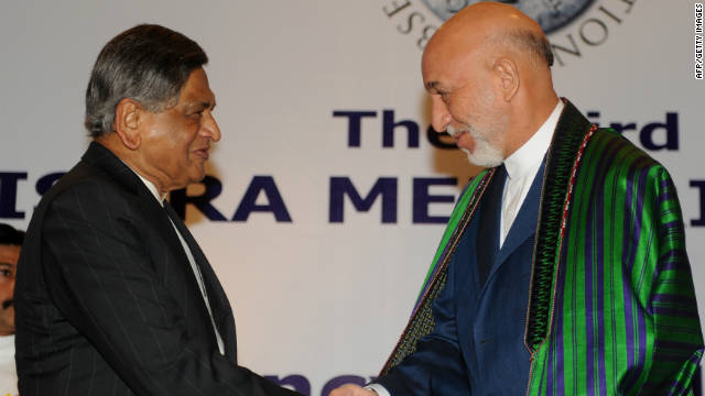 Afghan President Hamid Karzai, right, greets Indian Foreign Minister S.M. Krishna in New Delhi on Wednesday.