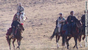 U.S. Special Operations Forces ride into northern Afghanistan in October 2001 on horseback