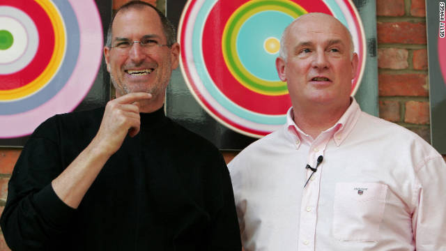 Jobs laughs as he poses with Eric Nicoli, chief executive officer of EMI, while promoting a new partnership in London in April 2007. 