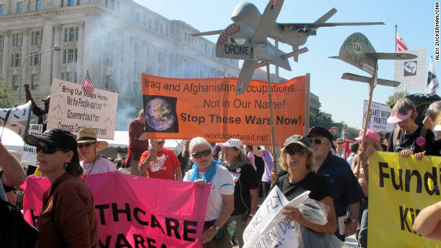Protesters against the war in Afghanistan and government spending march to the Air and Space Museum for Occupy D.C.
