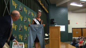 Bree Boyce, who is Miss South Carolina holds a pair of size 18 jeans she wore in high school.