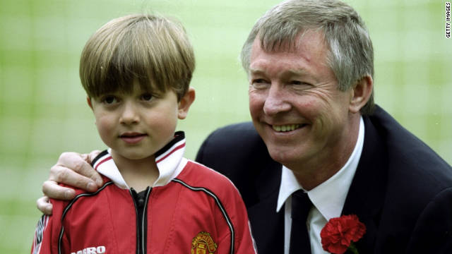Ferguson with his grandson Jake before the 1999 FA Cup final victory against Newcastle that sealed United's third double in six years.