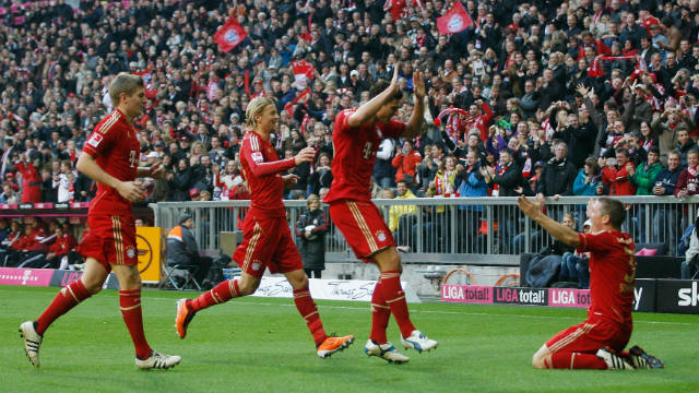 Bastian Schweinsteiger (right) celebrates with his Bayern teammates after scoring in the 4-0 win over Nuremberg