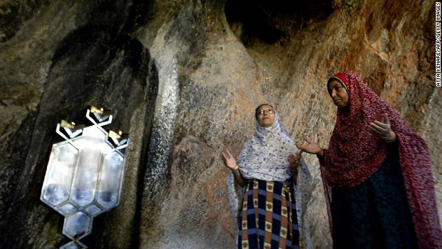 Zoroastrian worshipers pray near the central Iranian city of Yazd in 2004.