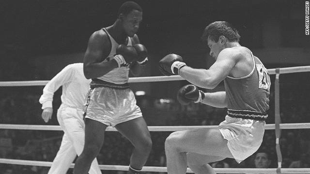  Joe Frazier and Russian Vadim Yemelyanov fight in a semifinal at the Olympic Games in Tokyo in 1964. Frazier went on to win gold. 