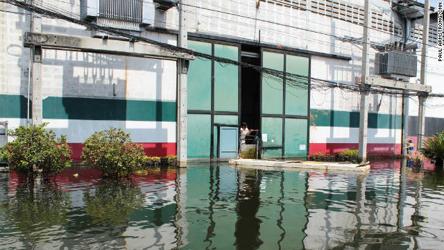 Like many businesses across Thailand, Romeo's factory is fighting to keep out the surrounding water.