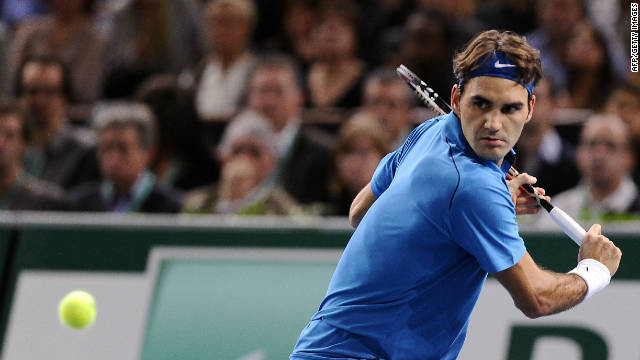 Roger Federer prepares to play a return during his Paris Masters final victory over Jo-Wilfried Tsonga