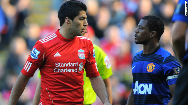 Luis Suarez (L) and Patrice Evra clashed during the game between Liverpool and Manchester United in October. 