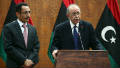 Abdel Hafiz Ghoga (L), vice chairman of the NTC listens Libya's interim prime minister Abdel Rahim al-Kib