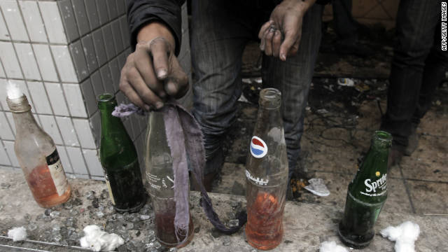 An Egyptian protester prepares Molotov cocktails Wednesday near Tahrir Square.