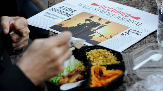 Occupy Wall Street protesters eat donated Thanksgiving meals in New York's Zuccotti Park on Thursday.