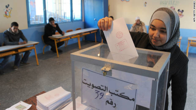 A Moroccan voter casts her ballot in the legislative election at a polling station in Rabat on November 25, 2011.