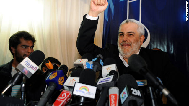 Abdelilah Benkirane, general secretary of the Justice and Development Party, raises his fist in victory during a news conference in Rabat, Morocco, on Sunday.