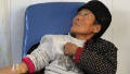 An elderly AIDS patient is treated at a clinic in Fuyang, in east China's Anhui province on November 28, 2011.