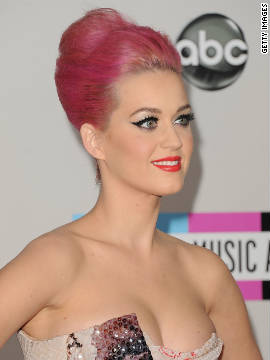 The pop star sports a bright pink updo at the American Music Awards on November 20. Perry was first spotted with bubblegum locks in August. She showed off the wild hue -- with help from some <a href='http://marquee.blogs.cnn.com/2011/08/29/celebs-make-up-for-gagas-tame-vma-look-with-eccentric-outfits/' target='_blank'>unconventional hair accessories</a> -- at MTV's Video Music Awards.