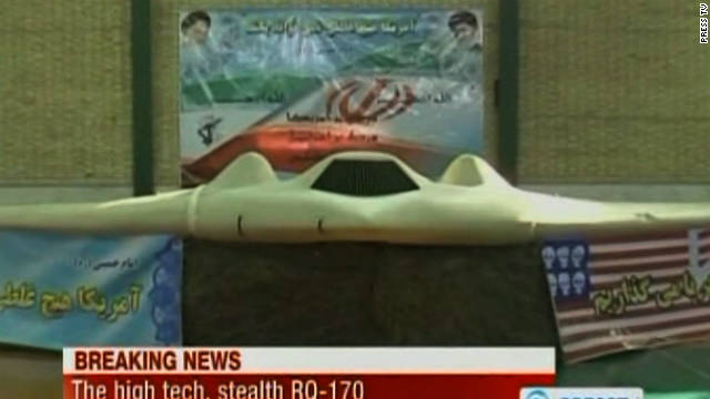 Iranian officials display what they say is an unmanned U.S. spy plane brought down in Iran last week.