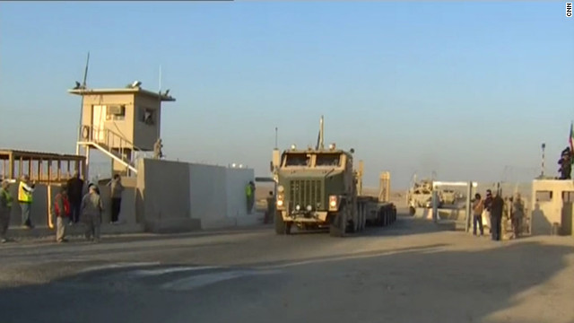 A U.S. cargo trailer crosses the Iraq-Kuwait border for the final time.